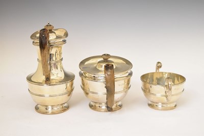 Lot 272 - Late Victorian three-piece silver set comprising sugar bowl, teapot, and coffee pot