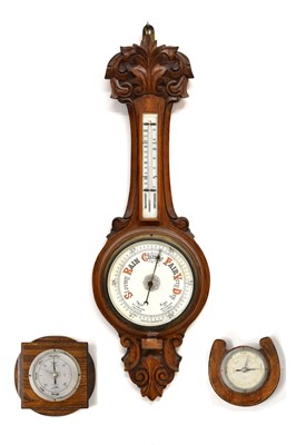 Lot 732 - Early 20th century oak wheel barometer and two smaller examples