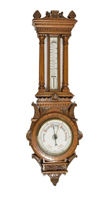 Lot 735 - Edwardian oak wheel barometer