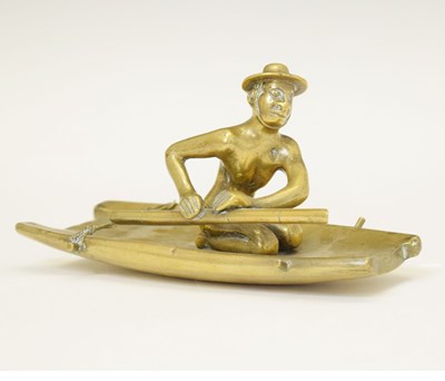 Lot 649 - V. Vallipurum & Sons, Negombo, Ceylon (Sri Lanka) - Brass figure of a gentleman on a raft