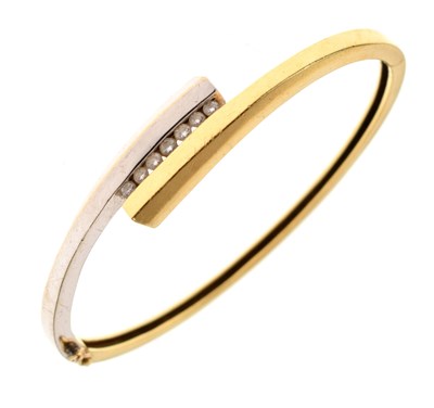 Lot 172 - Two-colour diamond set hinged 18ct gold bangle