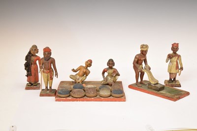 Lot 479 - Six 19th century Indian polychrome painted wooden figures