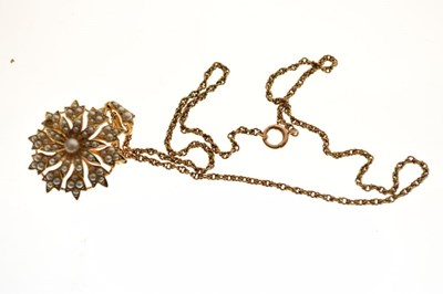 Lot 50 - Unmarked yellow metal and seed pearl 'snowflake' pendant
