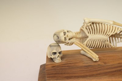 Lot 350 - Bone skeleton resting on plinth