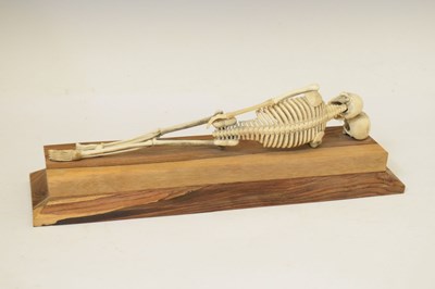 Lot 350 - Bone skeleton resting on plinth