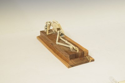 Lot 350 - Bone skeleton resting on plinth