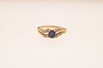 Lot 37 - 18c gold sapphire and white sapphire dress ring