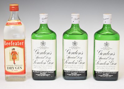 Lot 526 - Three bottles of Gordon's gin, and a bottle of Beefeater gin (4)