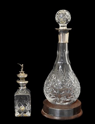 Lot 262 - Elizabeth II silver collared Hogget/Hoggit decanter, together with silver capped small decanter