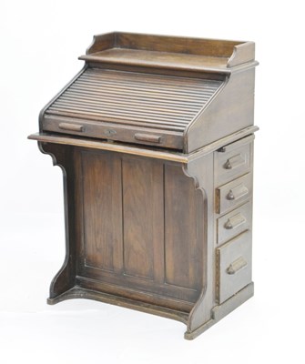 Lot 789 - Early 20th century oak roll top desk