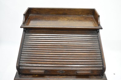 Lot 789 - Early 20th century oak roll top desk