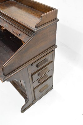 Lot 789 - Early 20th century oak roll top desk