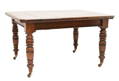 Lot 799 - Edwardian walnut 'Selbat' trademark extending dining table