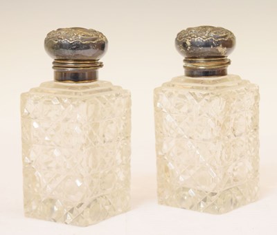 Lot 275 - Pair of Edwardian silver-mounted scent bottles