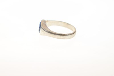 Lot 44 - Silver signet ring set a facetted oval cut sapphire