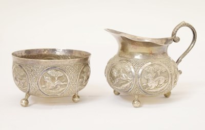 Lot 254 - Indian white-metal milk jug and sugar basin