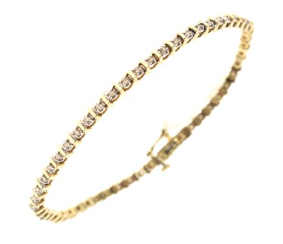 Lot 162 - 9ct gold illusion set diamond line bracelet