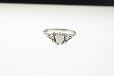 Lot 29 - 18ct white gold, opal and diamond dress ring