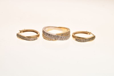 Lot 4 - 18ct two-colour gold diamond set crossover dress ring