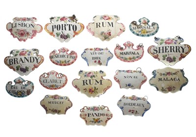 Lot 298 - Collection of seventeen mid 18th century and later enamel wine and spirit decanter labels