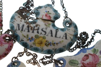 Lot 298 - Collection of seventeen mid 18th century and later enamel wine and spirit decanter labels