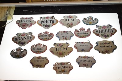 Lot 298 - Collection of seventeen mid 18th century and later enamel wine and spirit decanter labels