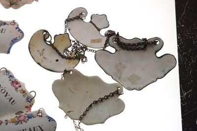 Lot 298 - Collection of seventeen mid 18th century and later enamel wine and spirit decanter labels