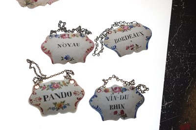 Lot 298 - Collection of seventeen mid 18th century and later enamel wine and spirit decanter labels