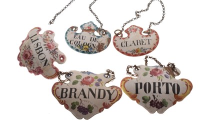 Lot 298 - Collection of seventeen mid 18th century and later enamel wine and spirit decanter labels
