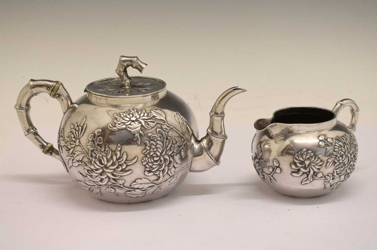 Lot 280 - Wang Hing - Chinese export white-metal teapot and milk jug