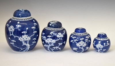 Lot 442 - Graduated set of four prunus vases and covers