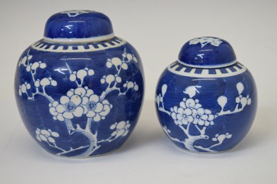 Lot 442 - Graduated set of four prunus vases and covers