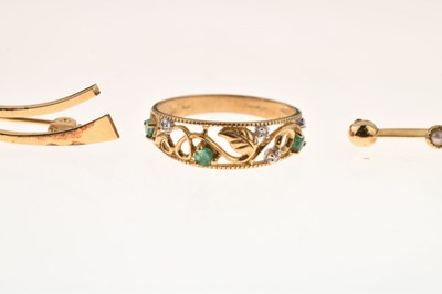 Lot 84 - 9ct gold pierced ring having foliate decoration and set emeralds and diamonds