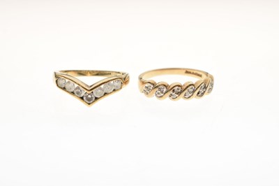 Lot 31 - Two 9ct gold dress rings, each set white stones