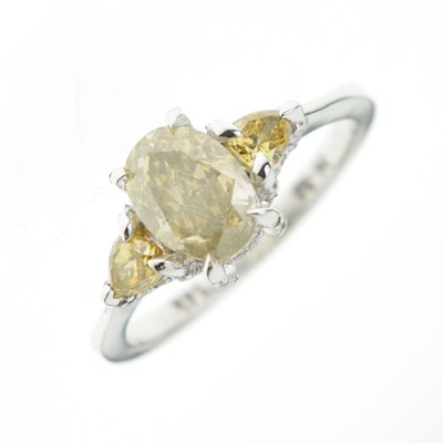 Lot 9 - Fancy colour diamond three-stone ring