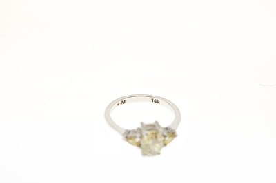 Lot 9 - Fancy colour diamond three-stone ring