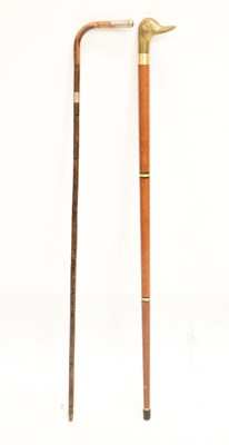 Lot 328 - Reproduction duck 'toper' walking stick and an early 20th century cane