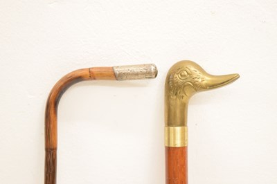 Lot 328 - Reproduction duck 'toper' walking stick and an early 20th century cane