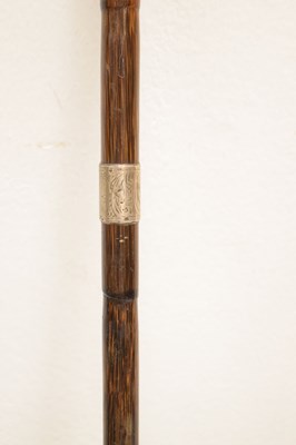 Lot 328 - Reproduction duck 'toper' walking stick and an early 20th century cane