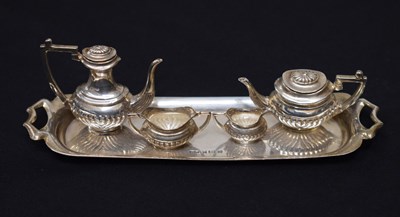 Lot 257 - Elizabeth II miniature silver four-piece tea set and tray