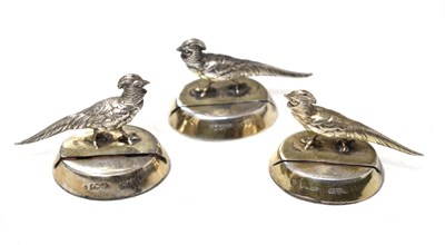 Lot 251 - Set of three George V silver menu holders in the form of a Chinese pheasant