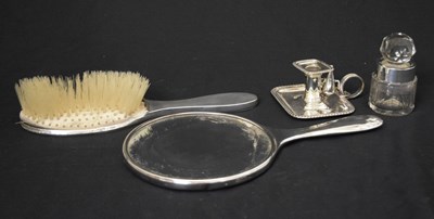 Lot 138 - Edward VII silver chamber stick, silver mounted perfume bottle, and two-piece dressing table set