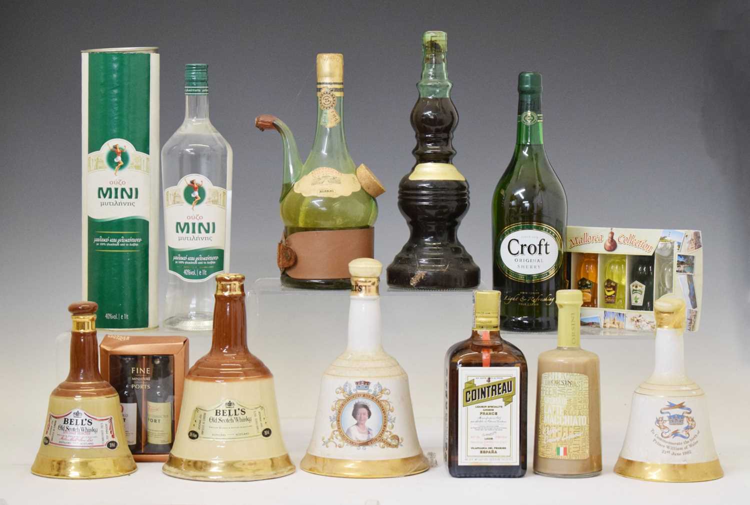 Lot 812 - Three Bells whisky decanters, a selection of miniatures and liquors, etc
