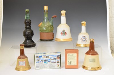 Lot 812 - Three Bells whisky decanters, a selection of miniatures and liquors, etc