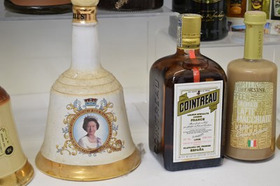 Lot 812 - Three Bells whisky decanters, a selection of miniatures and liquors, etc