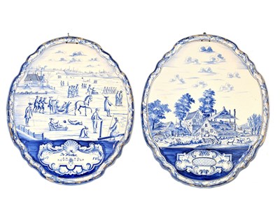 Lot 432 - Two Delft blue and white oval plaques