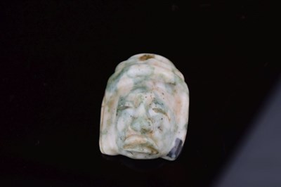 Lot 130 - Antiquities - Believed Pre-Columbian carved jade mask pendant