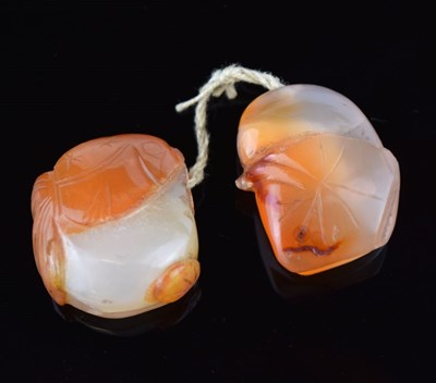 Lot 286 - Two Chinese carved peach agate miniature fruit