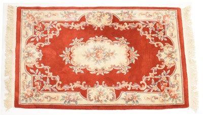 Lot 526 - Chinese claret ground wool rug