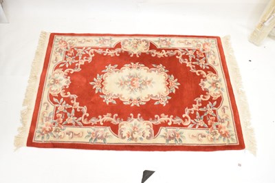 Lot 526 - Chinese claret ground wool rug